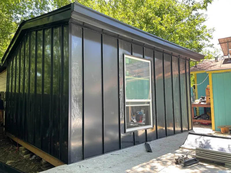 Black standing seam metal wall panels for Roof Inspection in Homewood